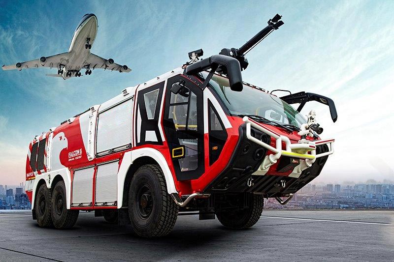 Ground support equipment vehicle with aircraft in background