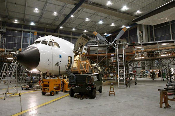 Aircraft maintenance technician working on engine